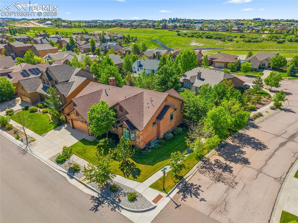 1117 Spectrum Loop Colorado Springs, CO 80921 - Photo 30 of 31 an aerial view of a city with lots of residential buildings ocean and mountain view in back
