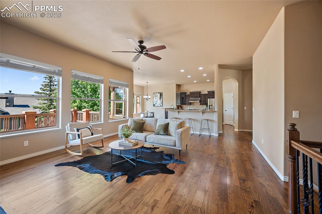 1117 Spectrum Loop Colorado Springs, CO 80921 - Photo 3 of 31 a living room with furniture and a wooden floor