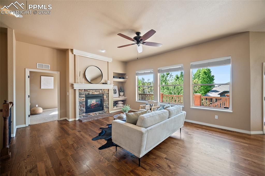 1117 Spectrum Loop Colorado Springs, CO 80921 - Photo 4 of 31 a living room with furniture and a fireplace