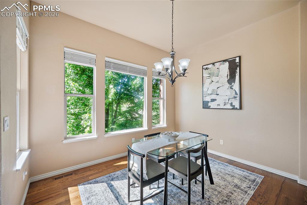 1117 Spectrum Loop Colorado Springs, CO 80921 - Photo 7 of 31 a view of a dining room with a table and chairs
