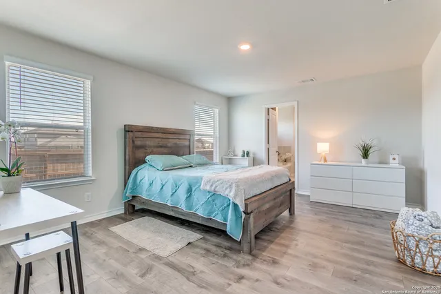 a bedroom with a bed and a table in it