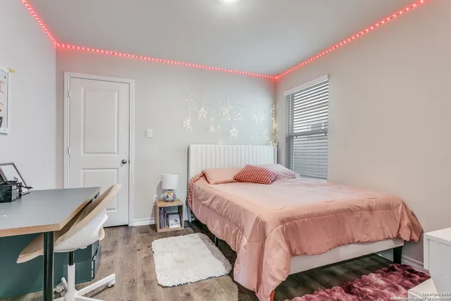 a bedroom with a bed and a table in it