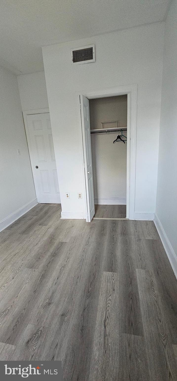 3618 Spring Garden Street Philadelphia, PA 19104 - Photo 19 of 41 an empty room with wooden floor & closet