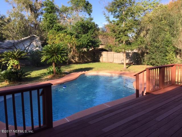 1344 Harbor Oaks Road Jacksonville, FL 32207 - Photo 1 of 40 a view of a yard with wooden fence