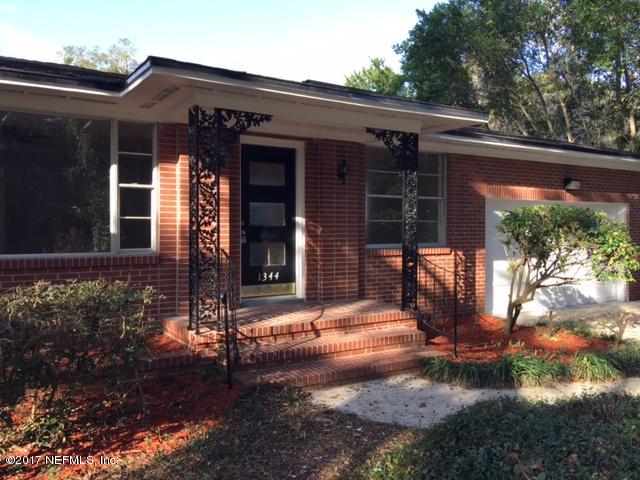 1344 Harbor Oaks Road Jacksonville, FL 32207 - Photo 2 of 40 a front view of a house with a yard