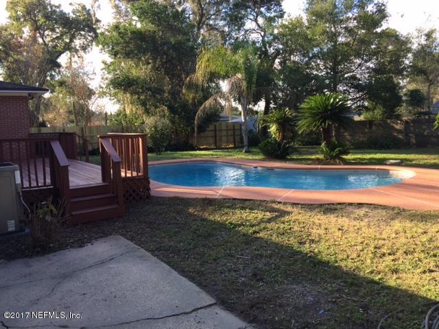 1344 Harbor Oaks Road Jacksonville, FL 32207 - Photo 28 of 40 a view of swimming pool with seating area and trees around