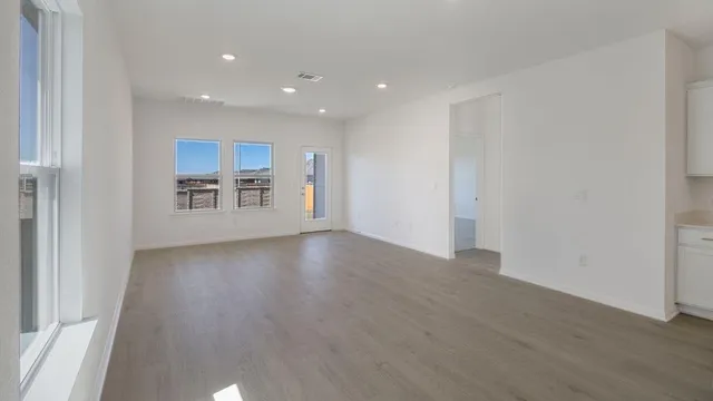 a view of a kitchen with a sink and a window