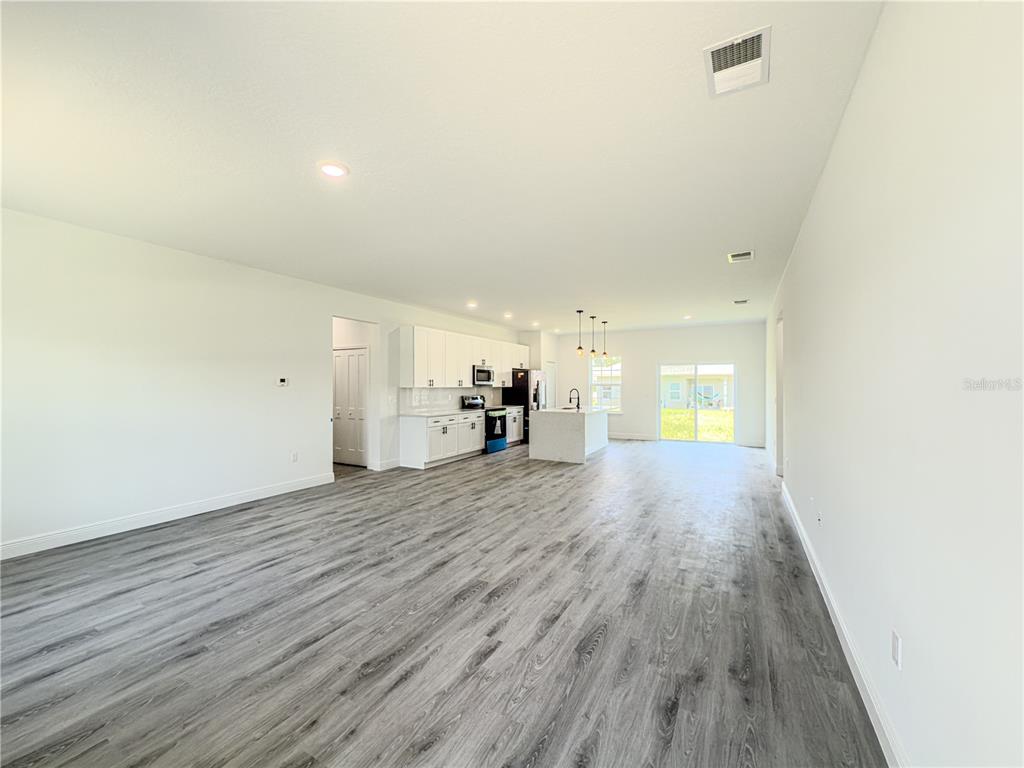 14245 Southwest 28th Court Ocala, FL 34473 - Photo 44 of 85 a view of empty room with wooden floor