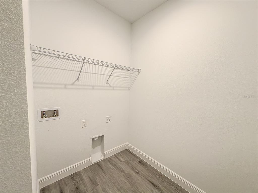 14245 Southwest 28th Court Ocala, FL 34473 - Photo 66 of 85 a view of a room with racks on the wall