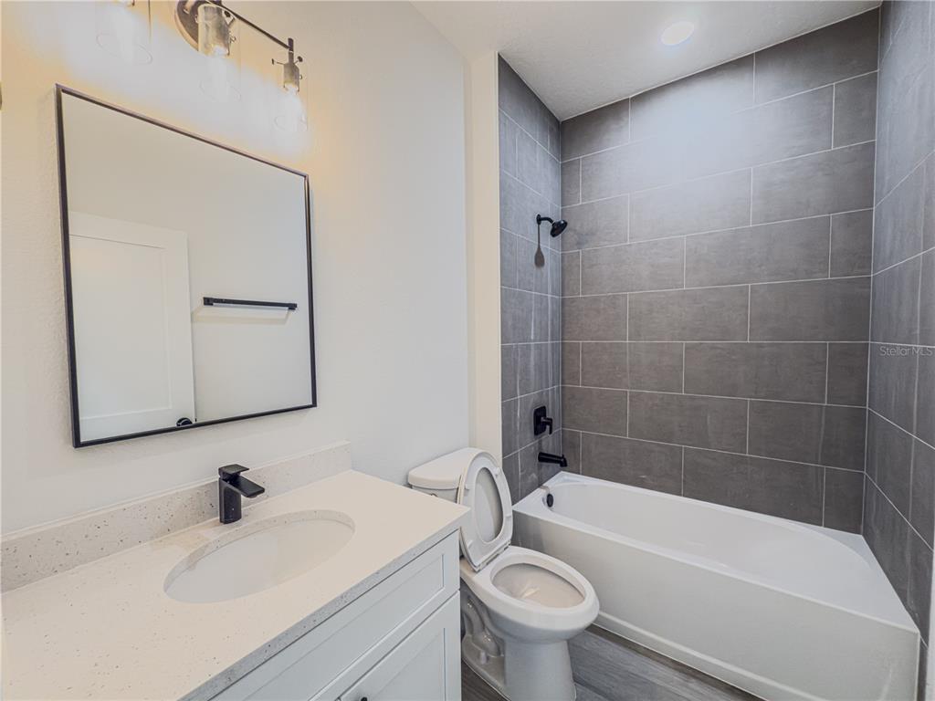 14245 Southwest 28th Court Ocala, FL 34473 - Photo 72 of 85 a bathroom with a sink a toilet and bathtub