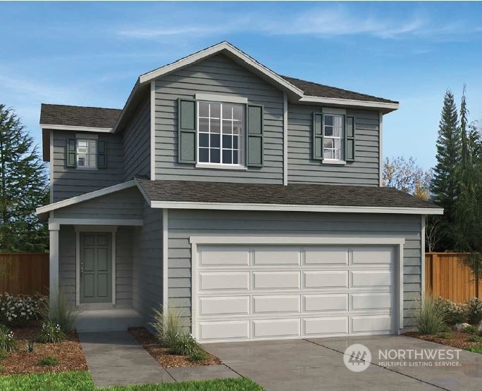 17822 Southeast 265 Street, Unit 9 Covington, WA 98042 - Photo 1 of 4 a front view of a house with a yard and garage