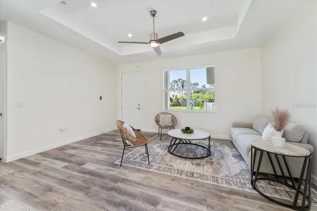a view of a livingroom with furniture and lounge chair