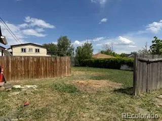 a view of backyard with green space