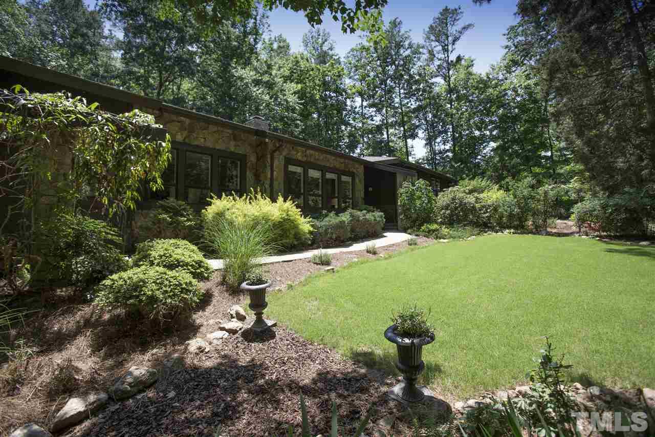 813 Thatcher Way Raleigh, NC 27615 - Photo 1 of 25 a backyard of a house with a yard and outdoor seating