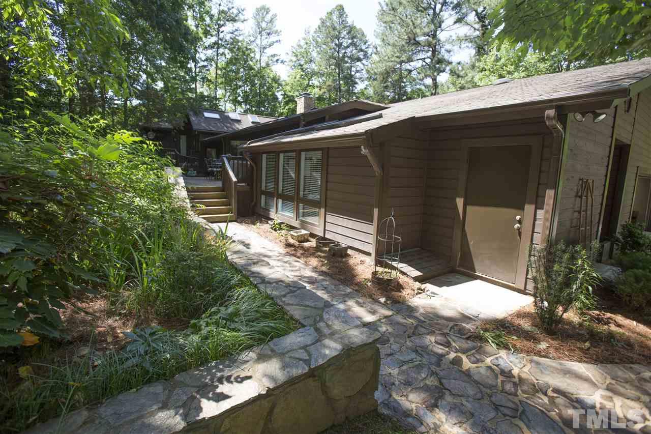 813 Thatcher Way Raleigh, NC 27615 - Photo 5 of 25 a backyard of a house with yard and outdoor seating