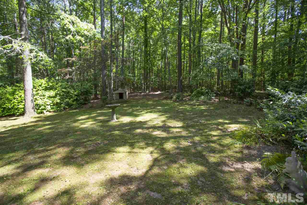 813 Thatcher Way Raleigh, NC 27615 - Photo 7 of 25 a view of outdoor space with a garden