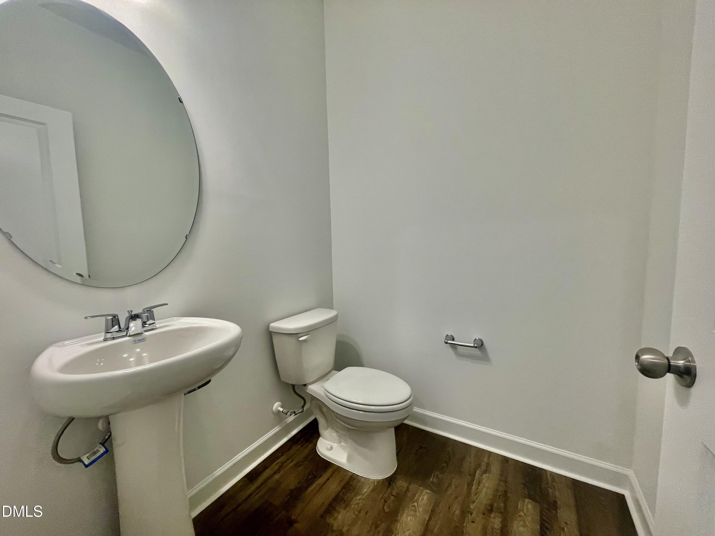 283 Yellow River Way Garner, NC 27529 - Photo 23 of 40 a bathroom with a sink toilet and a mirror