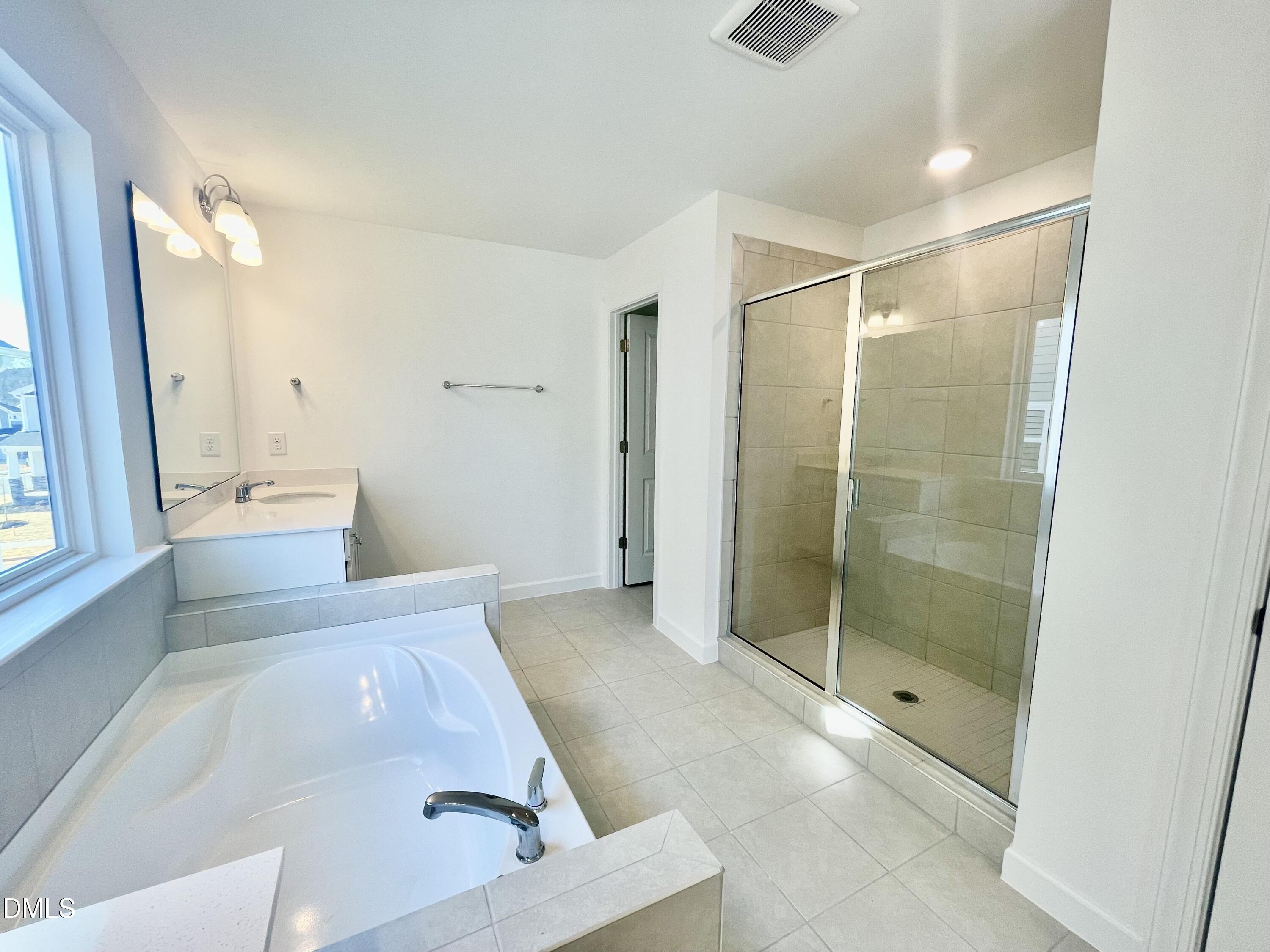 283 Yellow River Way Garner, NC 27529 - Photo 37 of 40 a bathroom with a shower and a tub