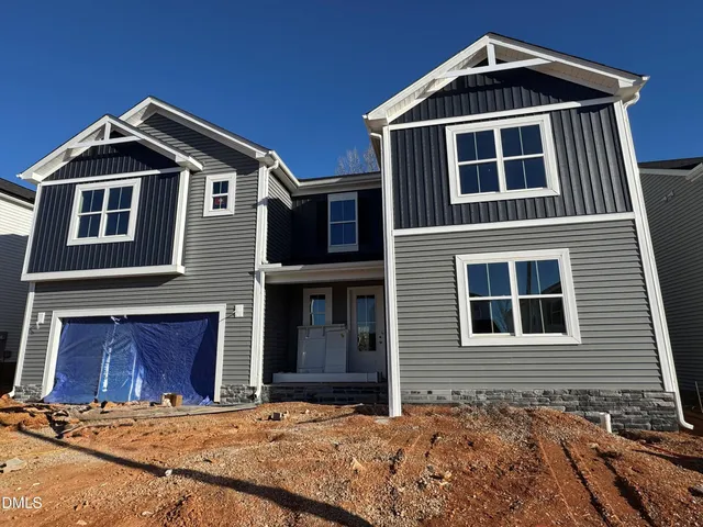 a front view of a house with yard