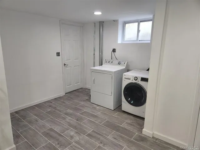 a view of a storage & utility room with washer and dryer