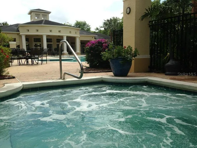 a view of a swimming pool with a patio