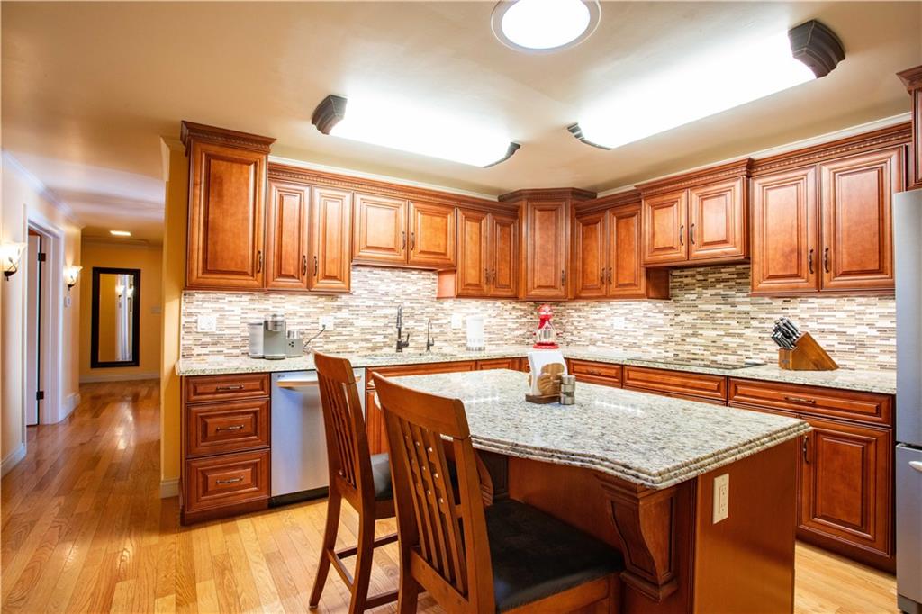 2145 Gypsy Glen Road Beaver, PA 15009 - Photo 13 of 46 a kitchen with stainless steel appliances granite countertop table chairs sink and cabinets