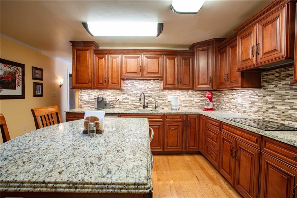 2145 Gypsy Glen Road Beaver, PA 15009 - Photo 14 of 46 a kitchen with a sink a stove and cabinets