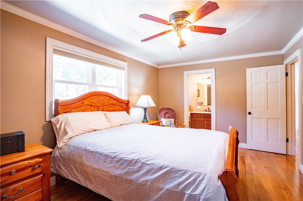 2145 Gypsy Glen Road Beaver, PA 15009 - Photo 19 of 46 a bedroom with a bed and a chandelier