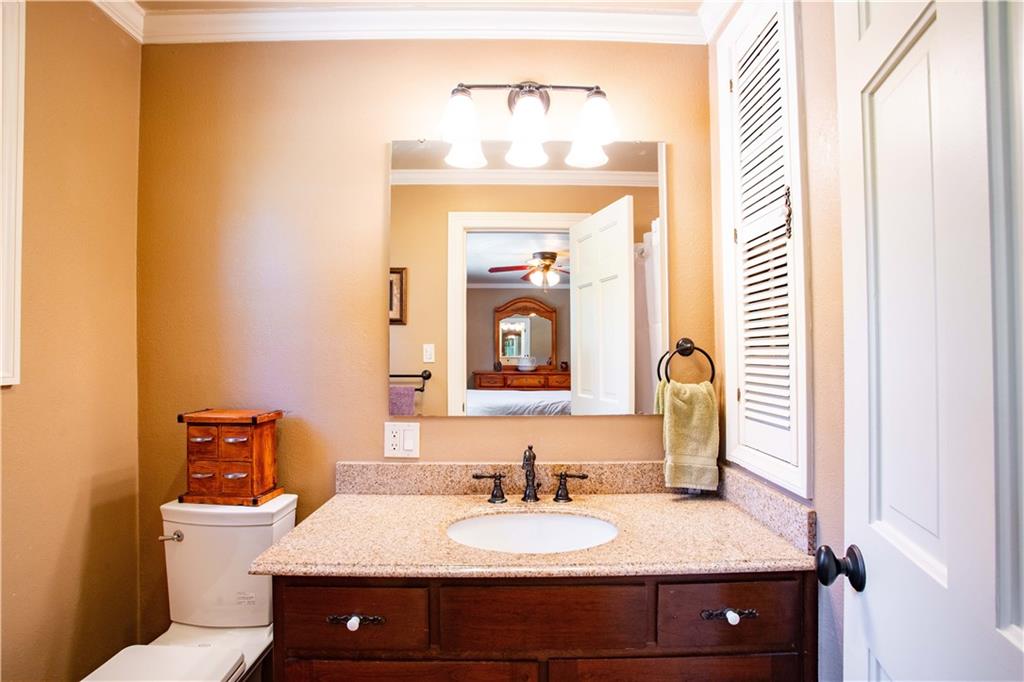 2145 Gypsy Glen Road Beaver, PA 15009 - Photo 20 of 46 a bathroom with a granite countertop sink and a mirror with toilet