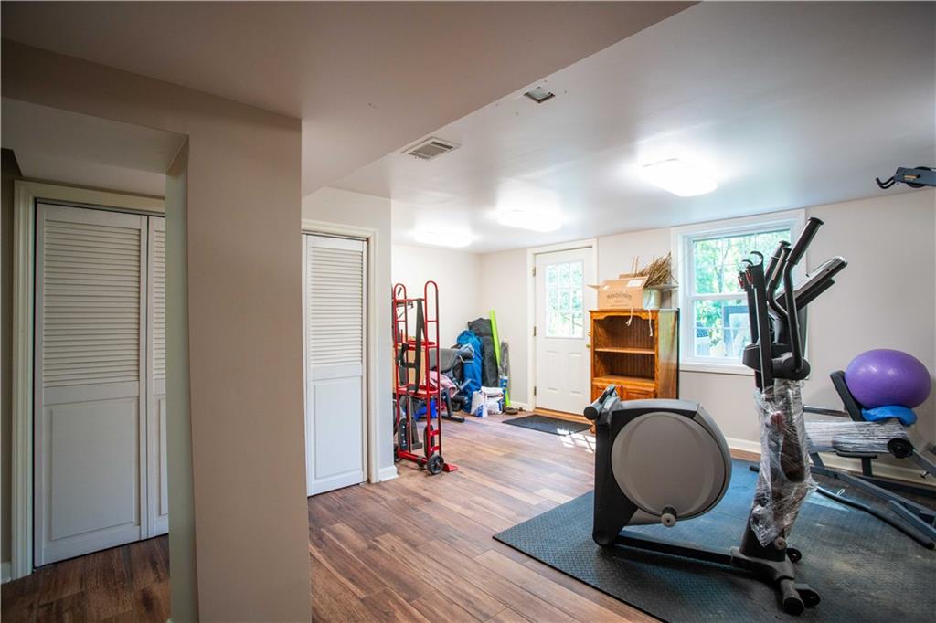 2145 Gypsy Glen Road Beaver, PA 15009 - Photo 26 of 46 a room with wooden floor and gym equipment