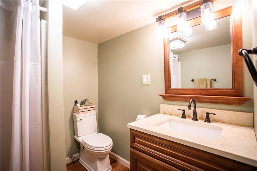 2145 Gypsy Glen Road Beaver, PA 15009 - Photo 29 of 46 a bathroom with a granite countertop toilet sink and a mirror