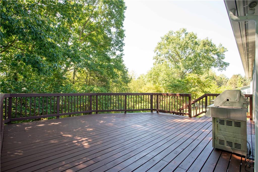 2145 Gypsy Glen Road Beaver, PA 15009 - Photo 33 of 46 a view of a deck with wooden floor and fence with a large garden