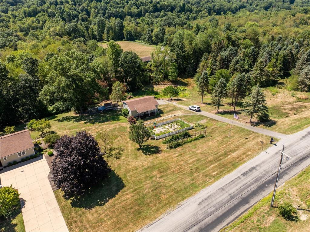 2145 Gypsy Glen Road Beaver, PA 15009 - Photo 4 of 46 a view of a backyard with table and chairs