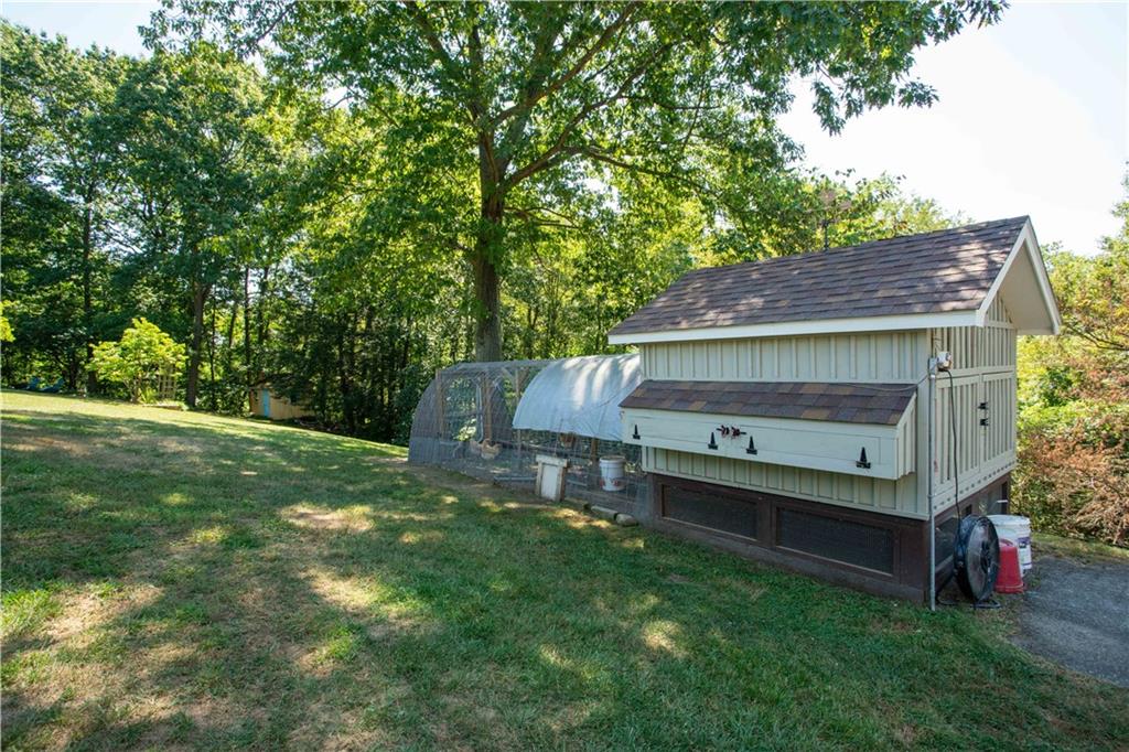 2145 Gypsy Glen Road Beaver, PA 15009 - Photo 44 of 46 a backyard of a house with table and chairs