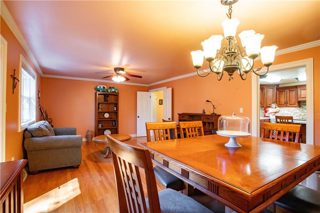 2145 Gypsy Glen Road Beaver, PA 15009 - Photo 9 of 46 a living room with furniture a chandelier and a dining table