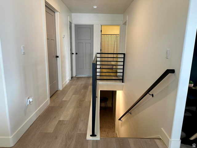 4349 Half Mile Road East Enoch, UT 84721 - Photo 25 of 36 Staircase featuring wood finished floors and baseboards