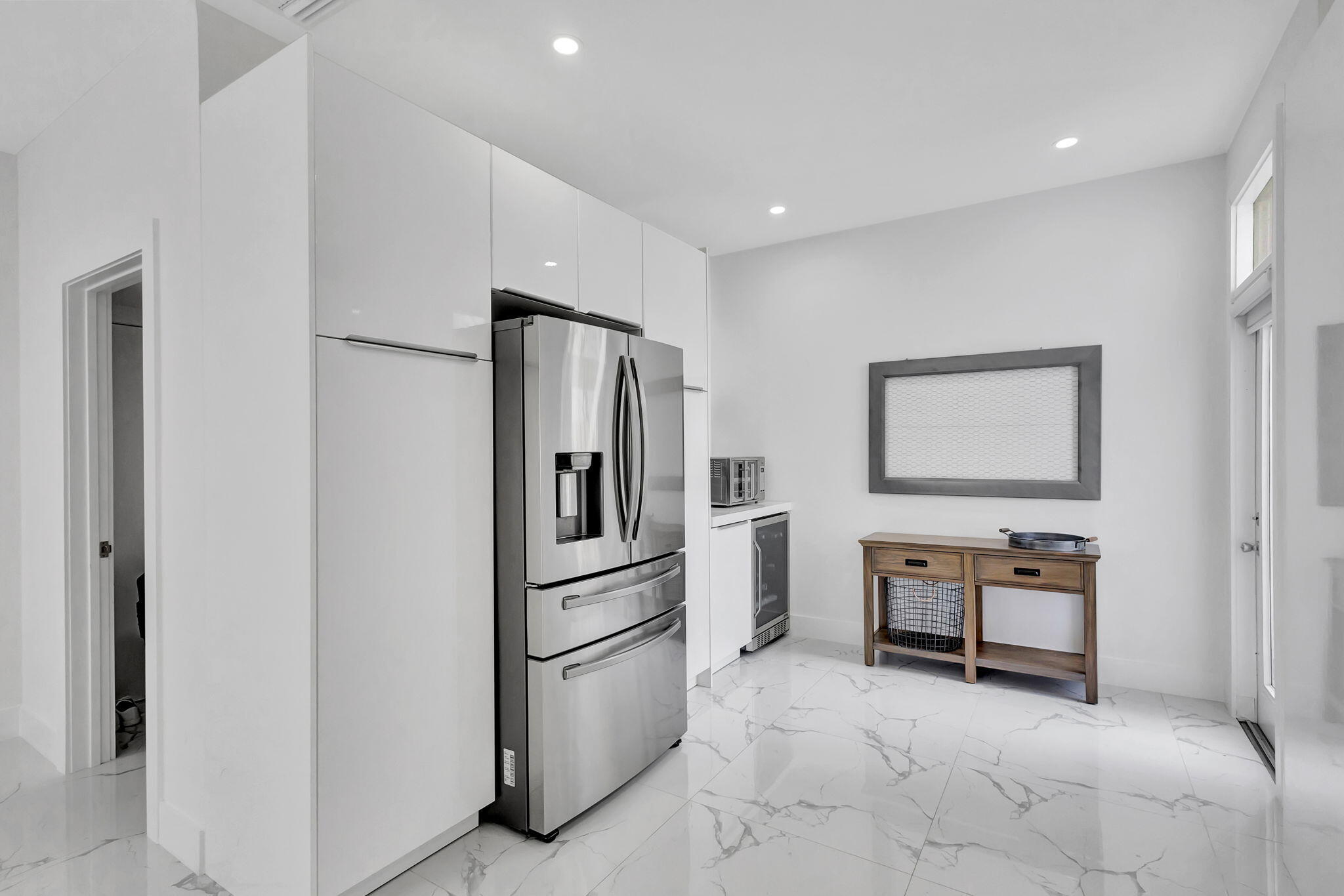 6631 Northwest 25th Avenue Boca Raton, FL 33496 - Photo 15 of 59 a room with furniture a washer and dryer