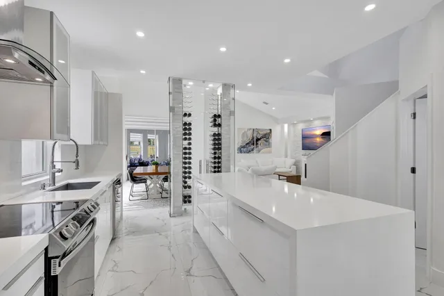 a kitchen with a stove and white cabinets