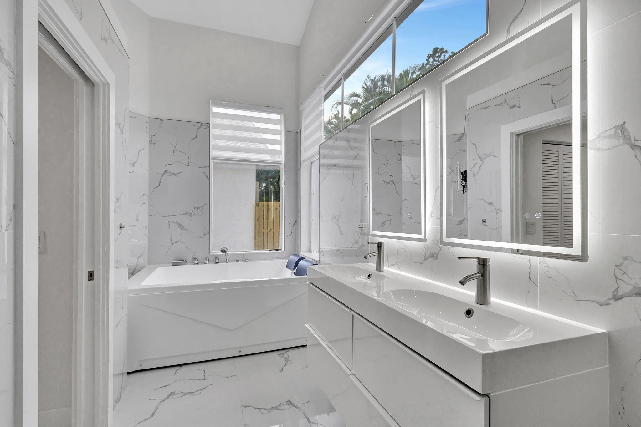 6631 Northwest 25th Avenue Boca Raton, FL 33496 - Photo 23 of 59 a bathroom with a sink and a bathtub