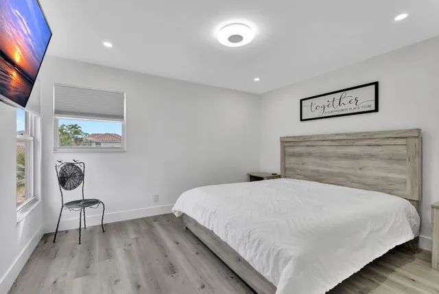 a bedroom with a bed and a view of bathroom