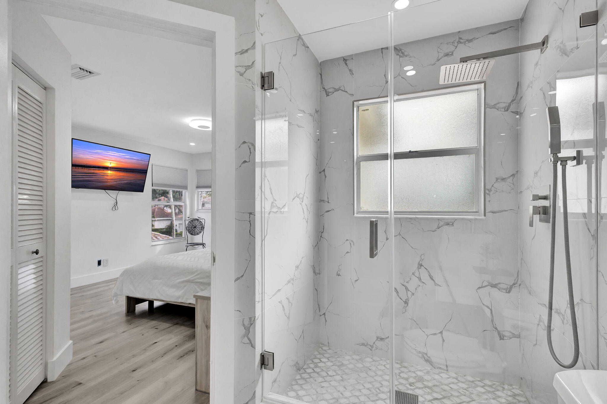 6631 Northwest 25th Avenue Boca Raton, FL 33496 - Photo 33 of 59 a en suite bathroom with a tub shower and a sink