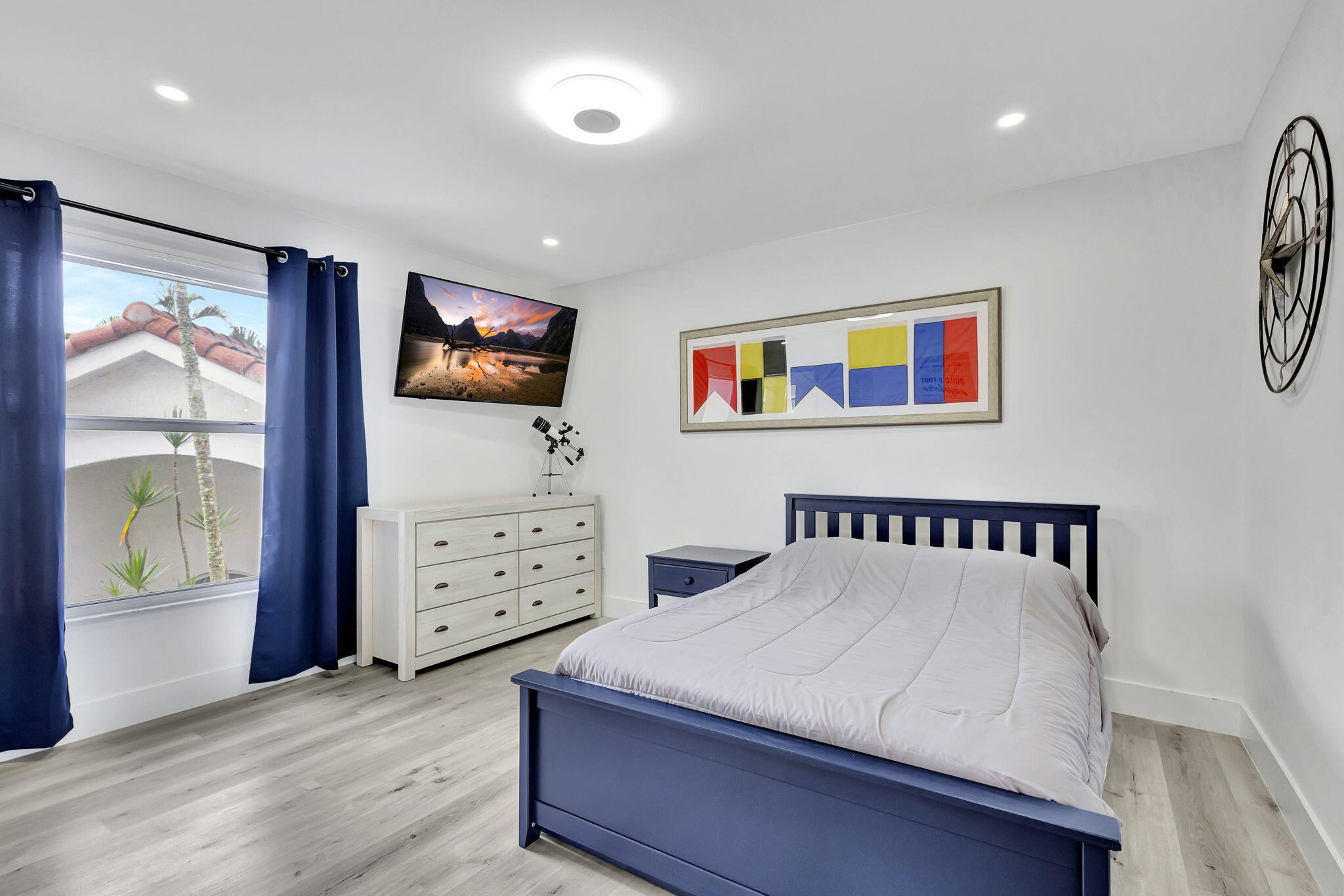 6631 Northwest 25th Avenue Boca Raton, FL 33496 - Photo 34 of 59 a bedroom with a bed and a flat screen tv