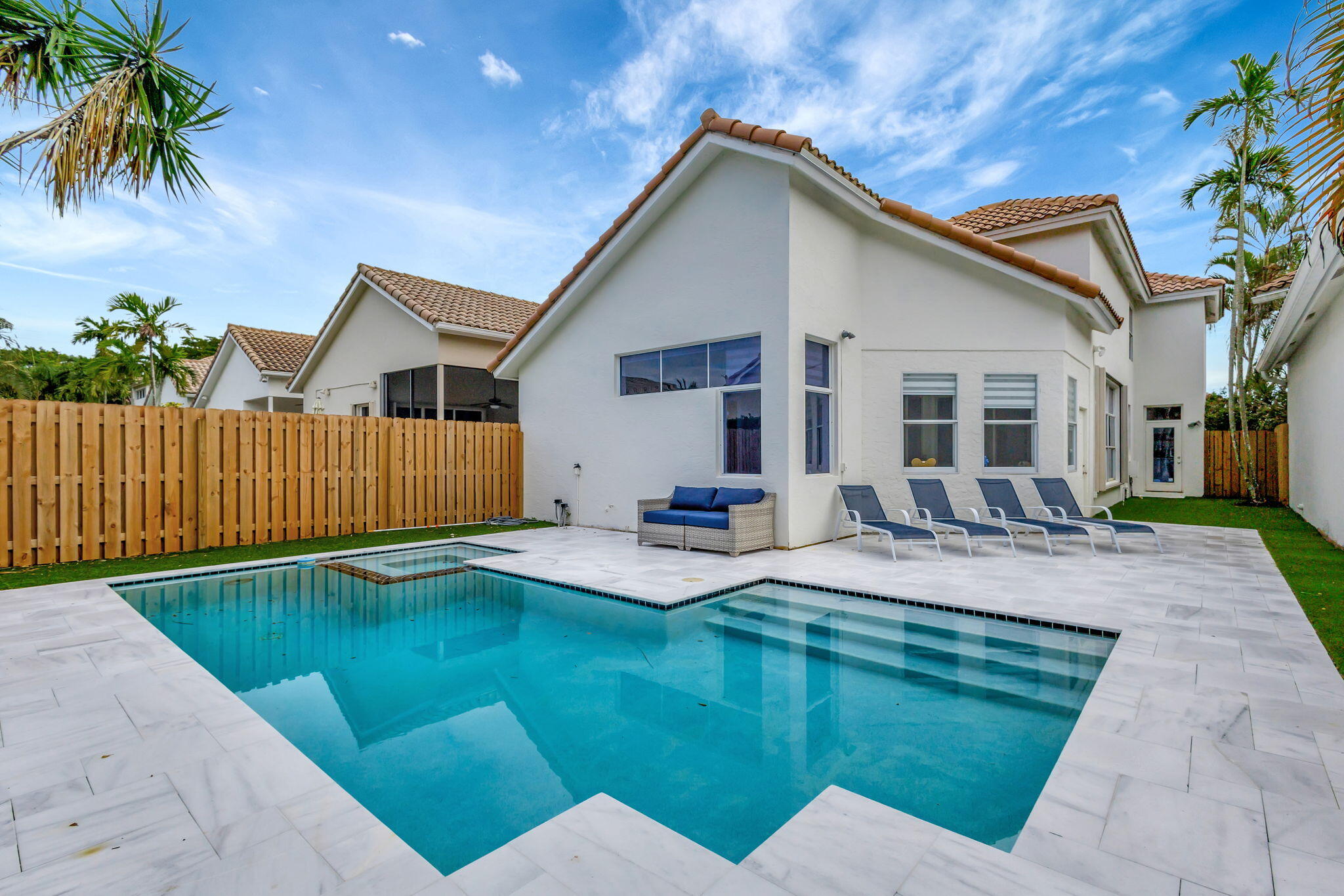 6631 Northwest 25th Avenue Boca Raton, FL 33496 - Photo 44 of 59 a view of house with swimming pool outdoor seating