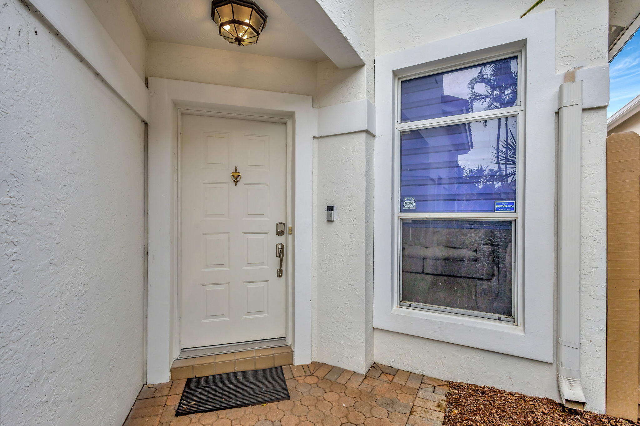6631 Northwest 25th Avenue Boca Raton, FL 33496 - Photo 6 of 59 a view of an entrance door of the house