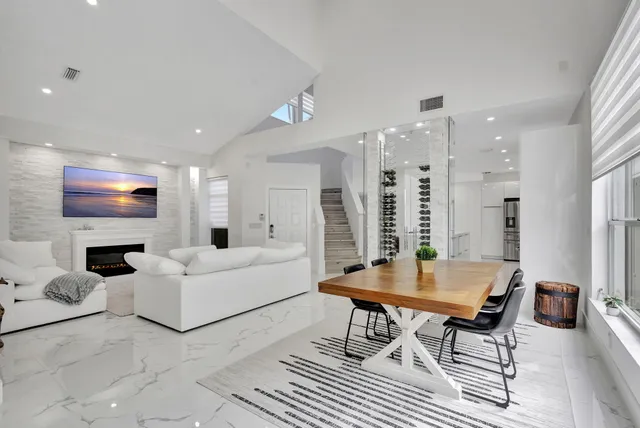 a view of a dining room with furniture and a window