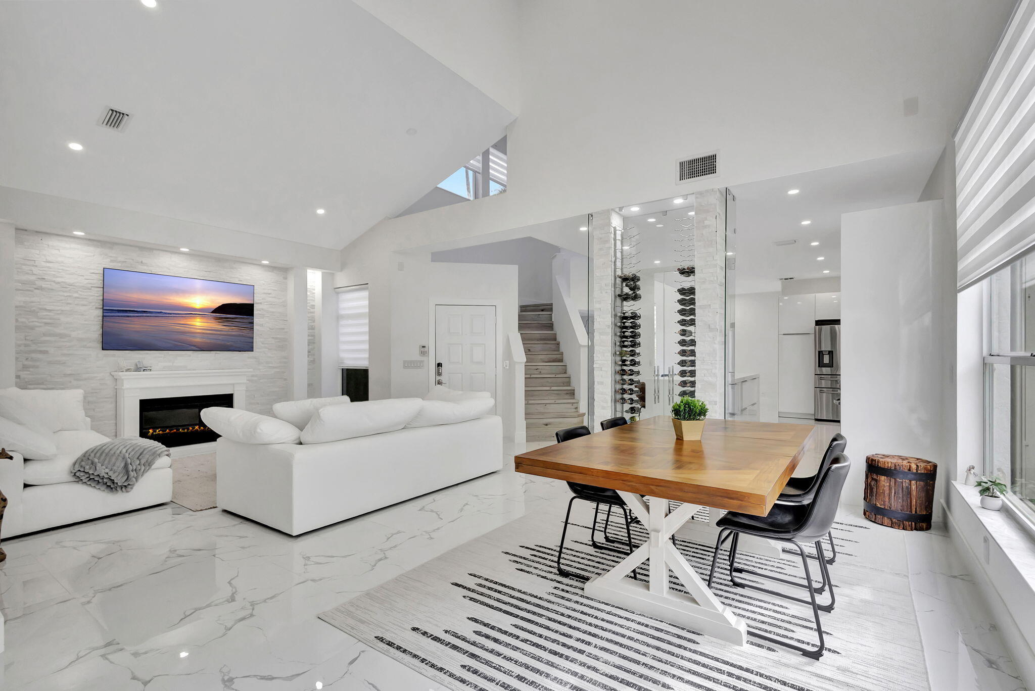 6631 Northwest 25th Avenue Boca Raton, FL 33496 - Photo 9 of 59 a living room with furniture a table and a flat screen tv