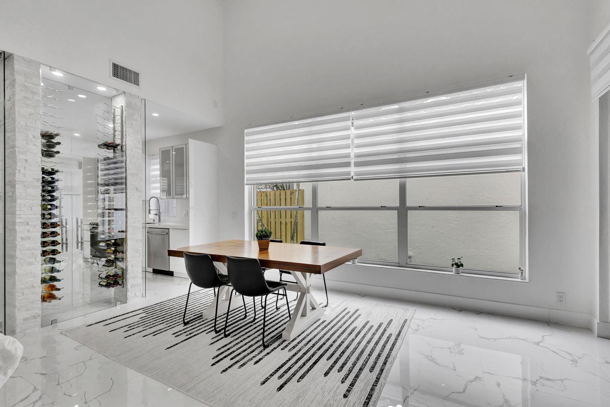 6631 Northwest 25th Avenue Boca Raton, FL 33496 - Photo 10 of 59 a view of a dining room with furniture and a window