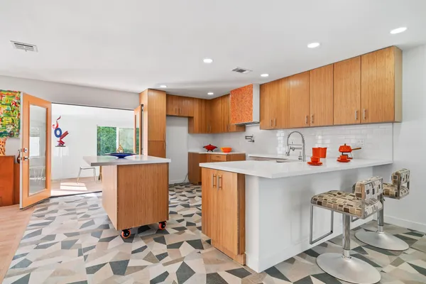 a kitchen with stainless steel appliances granite countertop a sink and cabinets