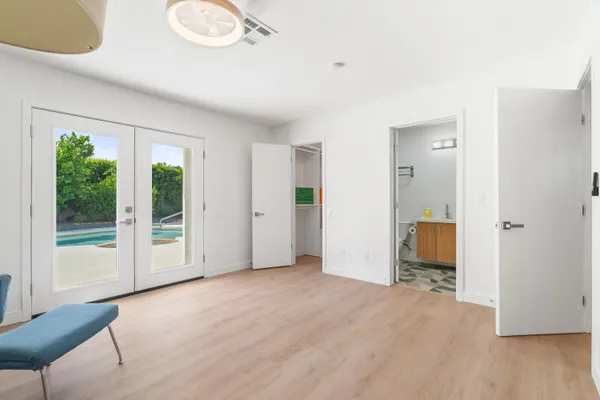 a bathroom with a sink a mirror and a shower