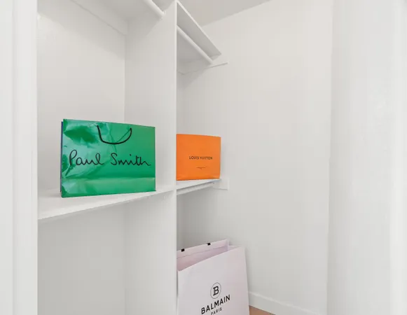 a room with a wooden floor and shoes